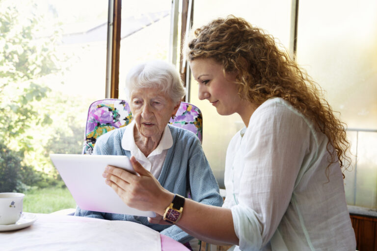 caregiver helping with technology
